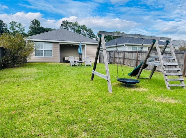 exterior space featuring a lawn and a playground