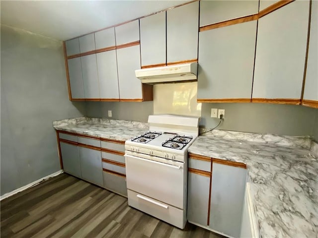 kitchen with white cabinetry, white gas range oven, and dark hardwood / wood-style flooring