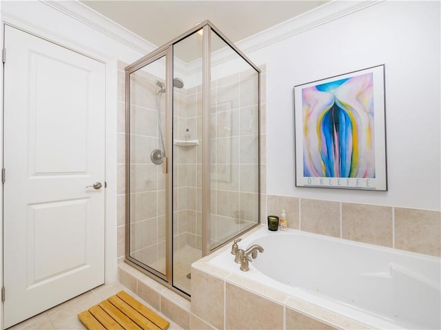 bathroom featuring tile patterned flooring, independent shower and bath, and ornamental molding