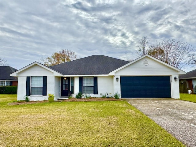 ranch-style home featuring a garage and a front lawn