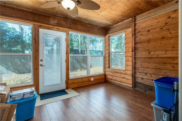 unfurnished sunroom with ceiling fan and wooden ceiling