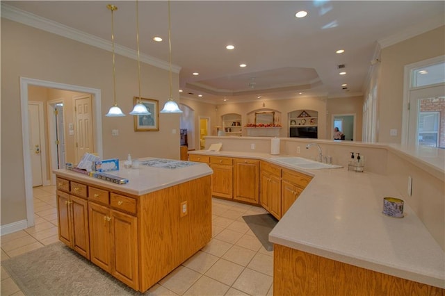 8857 Dawes Lake Rd S, Mobile, AL 36619 - kitchen with light tile patterned floors, a large island, ornamental molding, a sink, and open floor plan