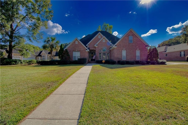 8857 Dawes Lake Rd S, Mobile, AL 36619 - view of front of house with a front yard and brick siding
