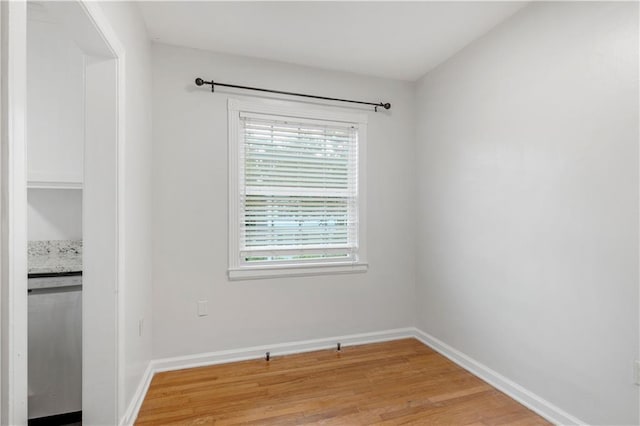 unfurnished room featuring light wood-type flooring