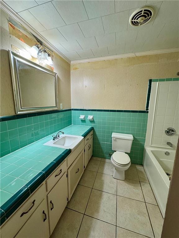 bathroom with crown molding, tile patterned floors, vanity, and toilet