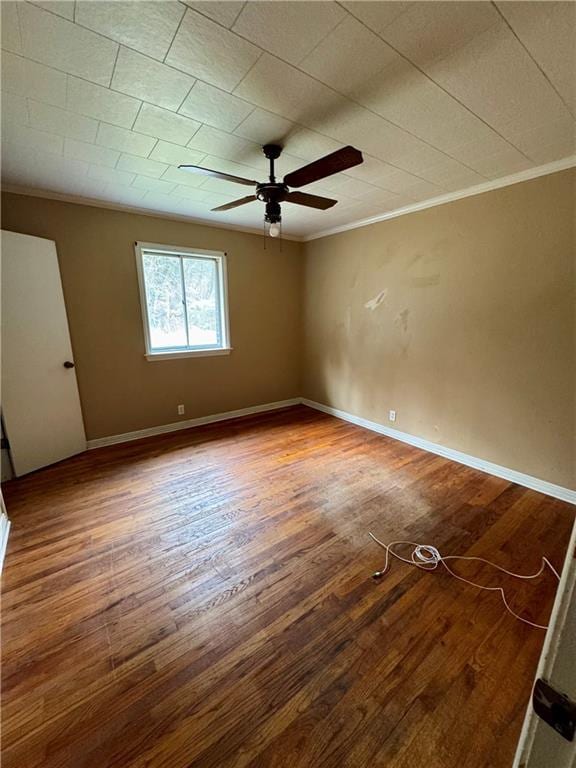 unfurnished room featuring crown molding, hardwood / wood-style floors, and ceiling fan