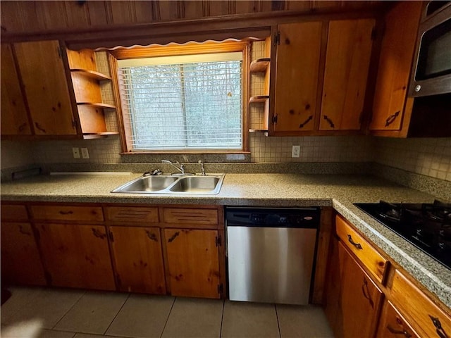 kitchen featuring sink, decorative backsplash, light tile patterned floors, and appliances with stainless steel finishes