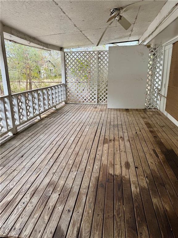 wooden deck with ceiling fan