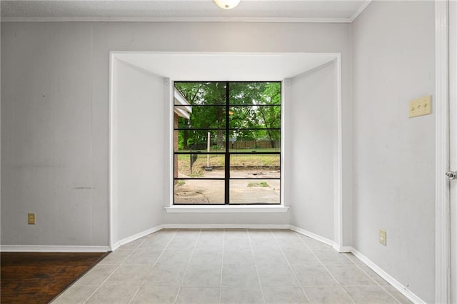 5717 Post Oak Ct, Mobile, AL 36609 - spare room with tile patterned floors, ornamental molding, and baseboards