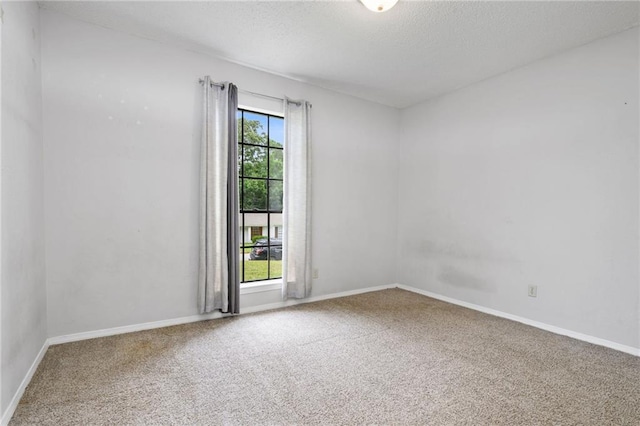5717 Post Oak Ct, Mobile, AL 36609 - spare room featuring carpet floors, baseboards, and a textured ceiling