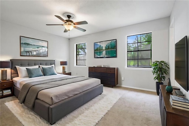 5717 Post Oak Ct, Mobile, AL 36609 - bedroom featuring light carpet, baseboards, and a ceiling fan