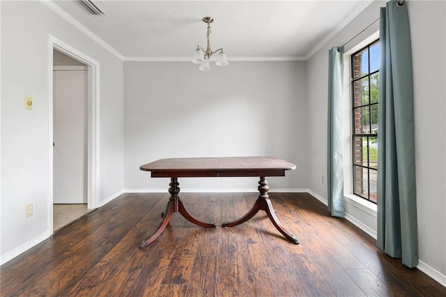 5717 Post Oak Ct, Mobile, AL 36609 - dining space with a chandelier, wood finished floors, crown molding, and baseboards