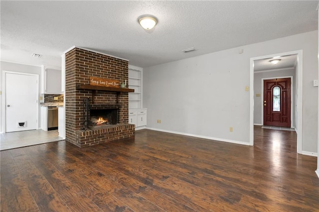 5717 Post Oak Ct, Mobile, AL 36609 - unfurnished living room with a textured ceiling, wood-type flooring, baseboards, a fireplace, and built in shelves
