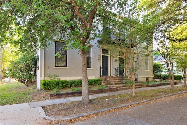 view of front of home featuring stucco siding