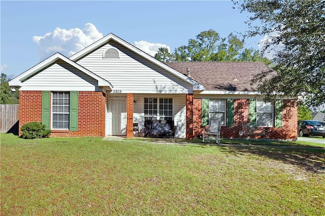 single story home with a front yard