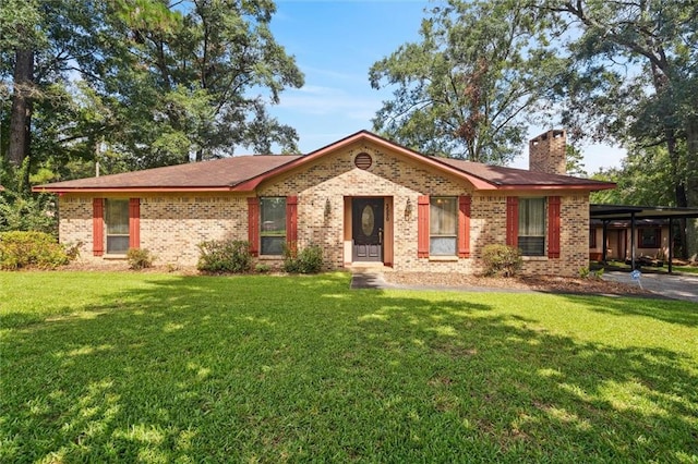 ranch-style home with a carport and a front lawn