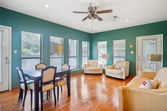 interior space featuring ceiling fan, plenty of natural light, and wood-type flooring