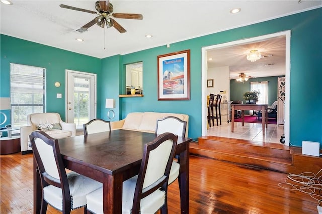 dining area featuring hardwood / wood-style floors, a wealth of natural light, and ceiling fan