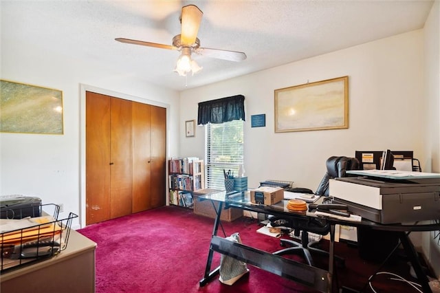 carpeted home office featuring ceiling fan