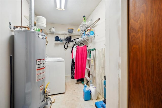 interior space featuring water heater and washing machine and clothes dryer