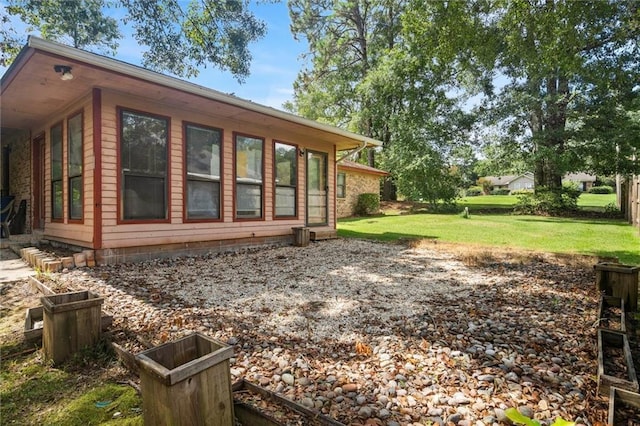 view of home's exterior featuring a lawn