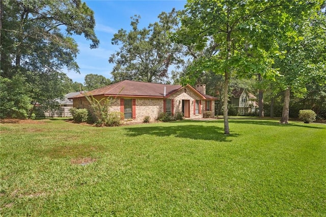 ranch-style house with a front lawn