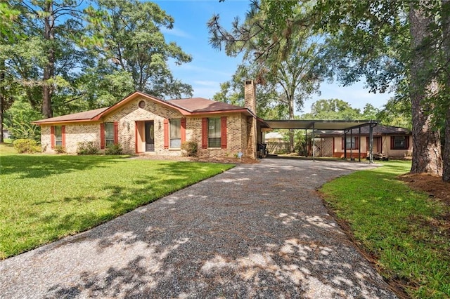 single story home with a carport and a front lawn