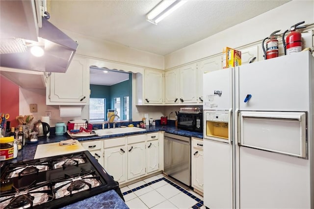 kitchen with sink, exhaust hood, black appliances, a textured ceiling, and white cabinets