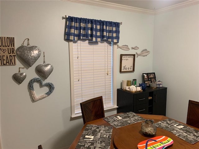 dining room featuring ornamental molding