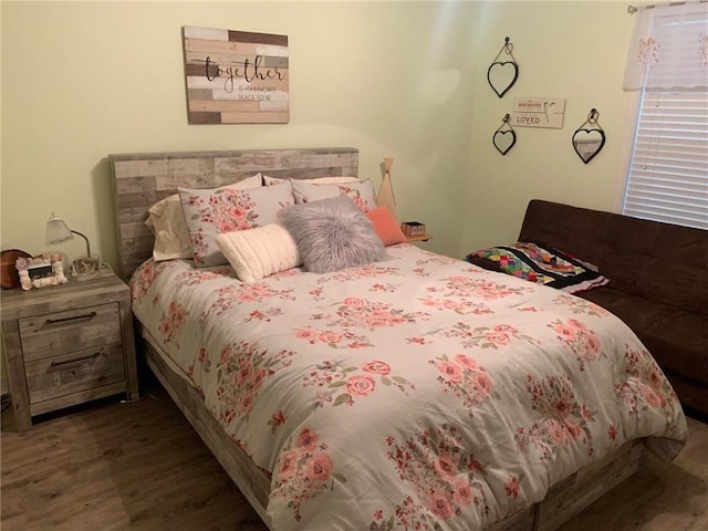 bedroom with dark wood-type flooring