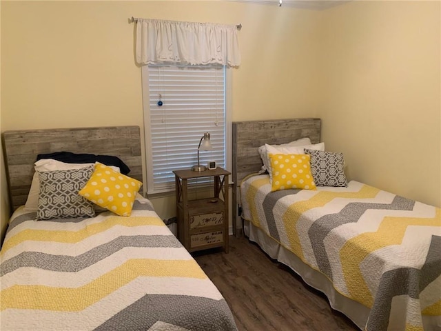 bedroom featuring dark hardwood / wood-style flooring