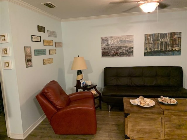 living room with ceiling fan, dark wood-type flooring, and ornamental molding