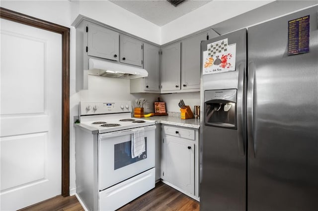 kitchen featuring gray cabinetry, under cabinet range hood, light countertops, stainless steel fridge, and white electric stove