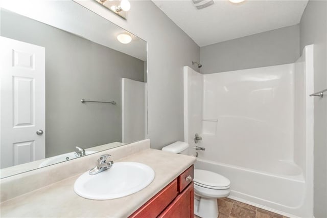 full bathroom with vanity, toilet, and shower / bathing tub combination