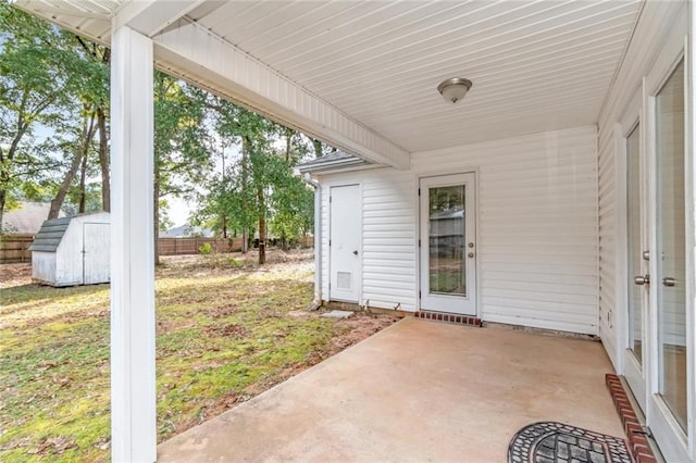 view of patio with a storage shed