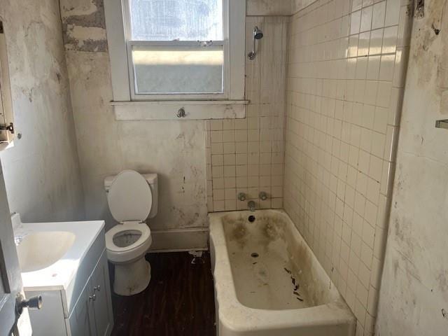 bathroom with hardwood / wood-style floors, vanity, and toilet