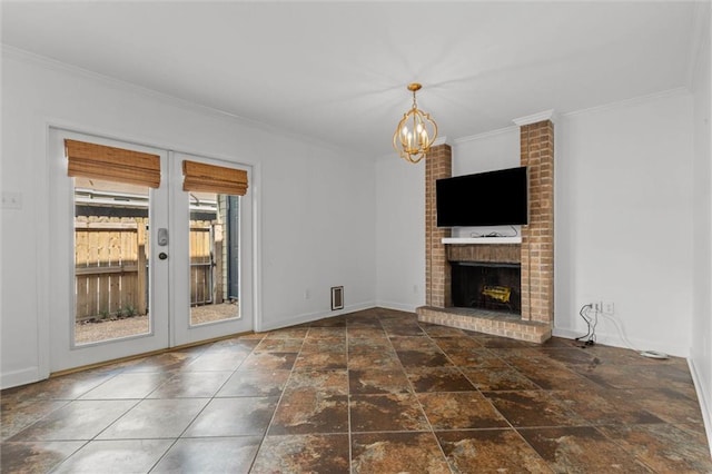 2901 Grant St Unit 601, Mobile, AL 36606 - unfurnished living room featuring french doors, a fireplace, ornamental molding, a chandelier, and stone finish flooring
