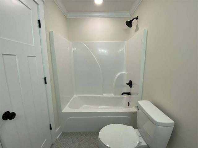 bathroom with ornamental molding,  shower combination, and toilet