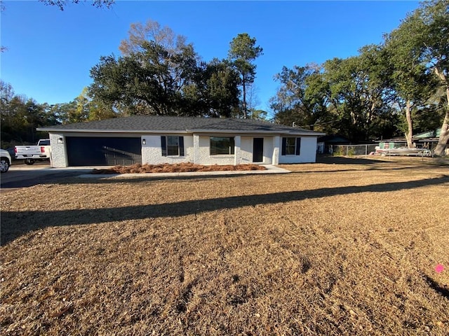 single story home featuring a garage