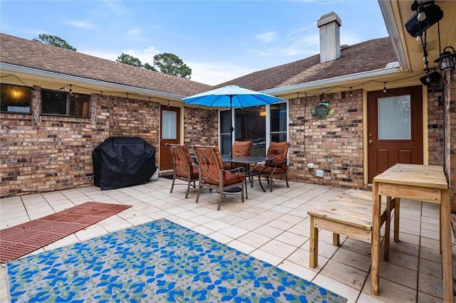 view of patio featuring a grill