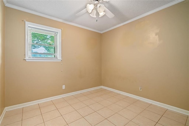 tiled spare room featuring ceiling fan, ornamental molding, and a textured ceiling