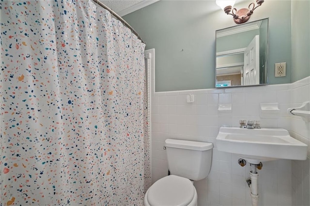 bathroom featuring tasteful backsplash, tile walls, and toilet