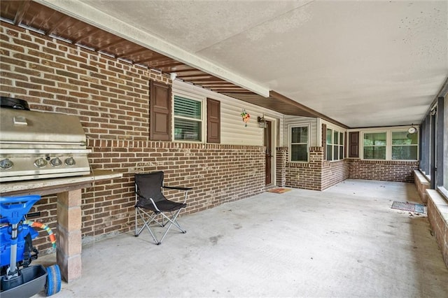 view of patio featuring a grill