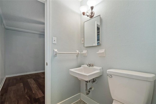 bathroom featuring toilet and hardwood / wood-style flooring