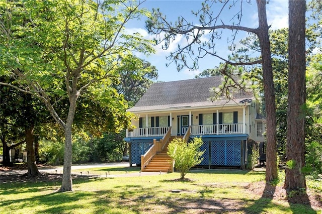 view of front of home with a porch and a front lawn