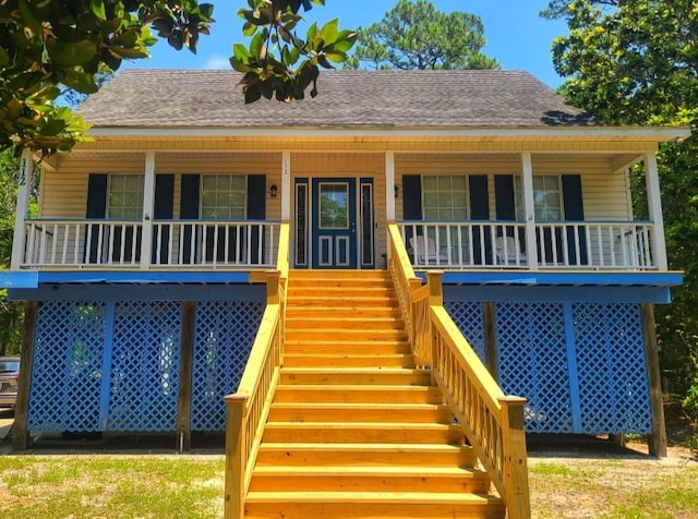 rear view of house with a porch