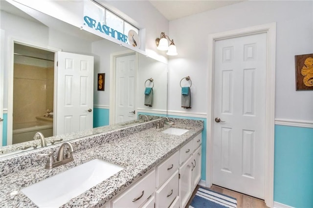 bathroom featuring vanity and hardwood / wood-style flooring