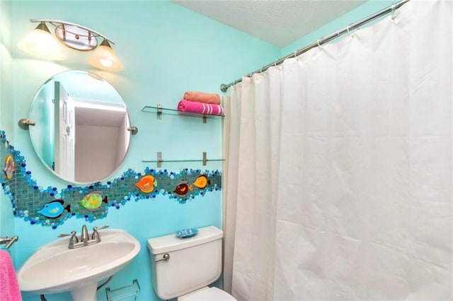 bathroom featuring sink and toilet