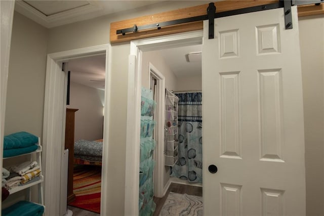 bathroom featuring hardwood / wood-style flooring and walk in shower