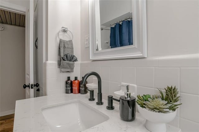 bathroom featuring backsplash, vanity, and toilet